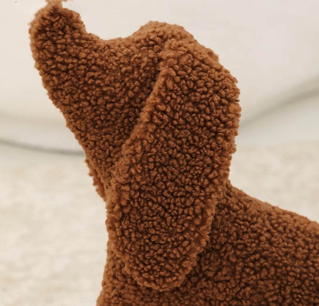 Brown plush dachshund pillow with soft textured fabric, perfect for cozy decor and waist support.