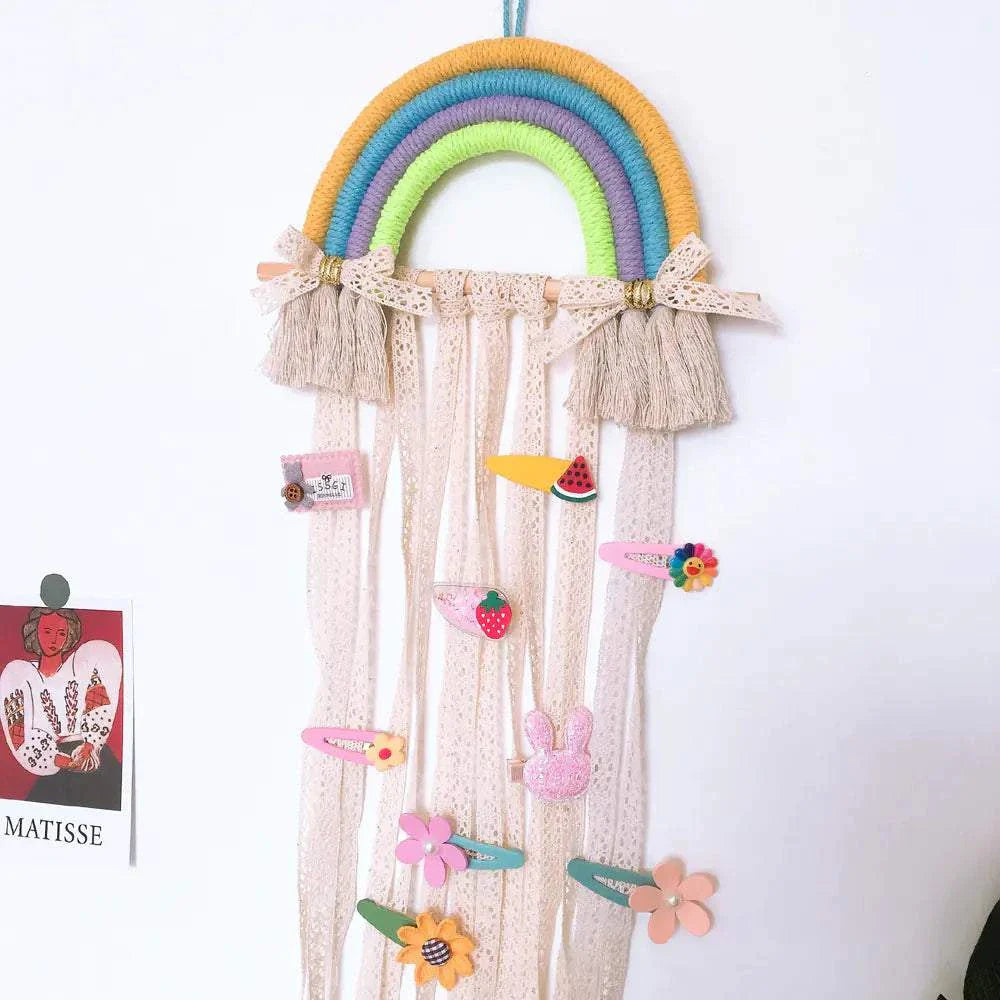 Nordic style woven rainbow hair clip organizer rack with colorful braided design and hanging ribbons for kids' accessories storage