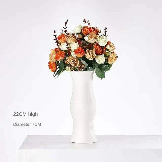 White hemp rope ceramic vase with modern minimalist design holding orange and cream flowers, 22cm high and 7cm diameter