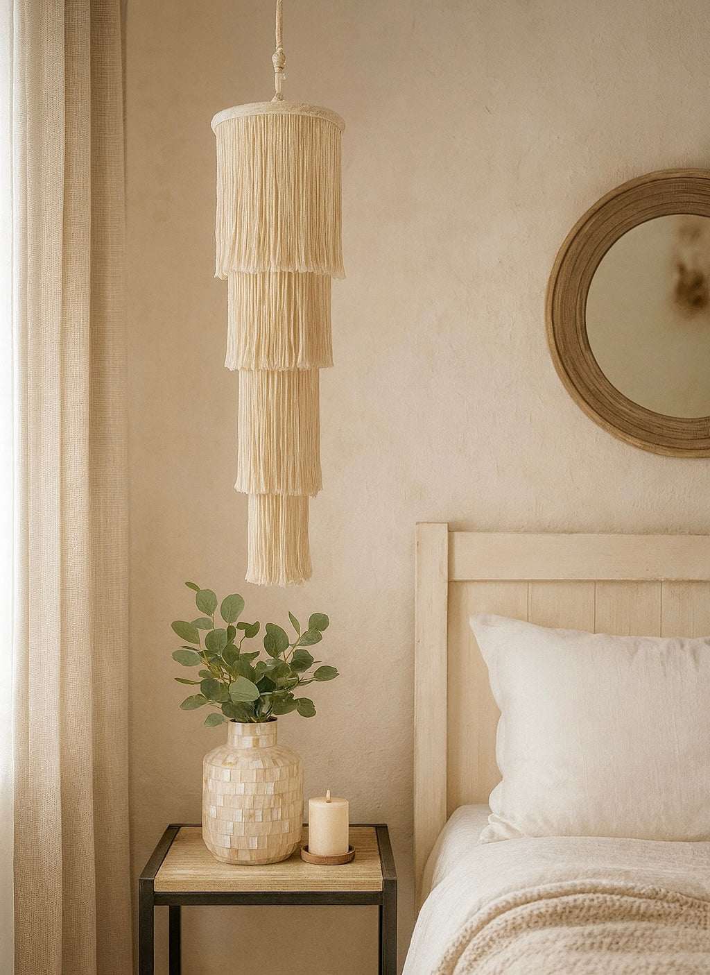 Handmade Bohemian tapestry lampshade with tassel design hanging above bedside table in cozy bedroom decor