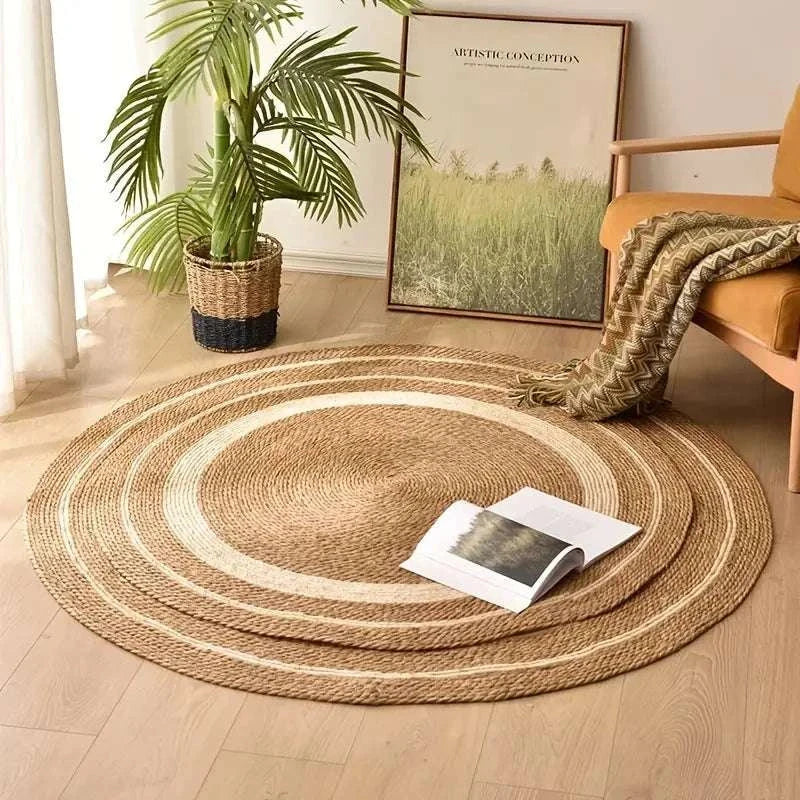 Nordic style woven round rattan carpet with papyrus color stripes in a cozy living room setting