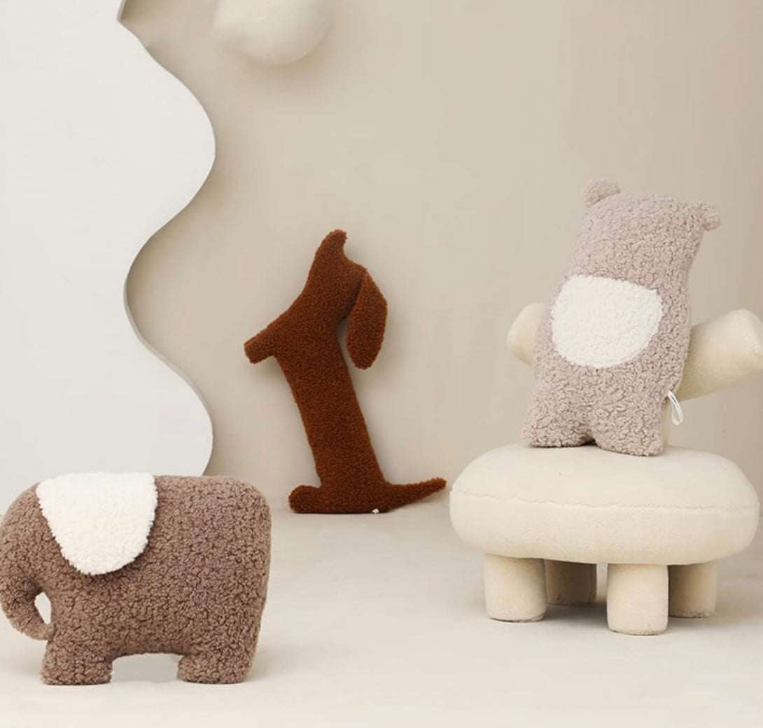 Brown plush dachshund pillow with soft texture for cozy home decor and support.