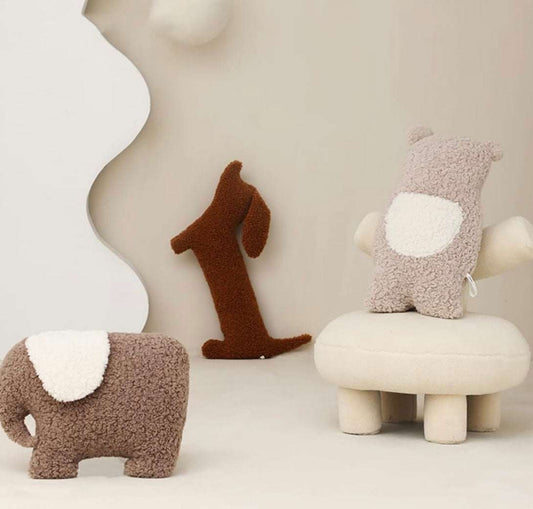 Brown plush dachshund pillow with soft texture for cozy home decor and support.