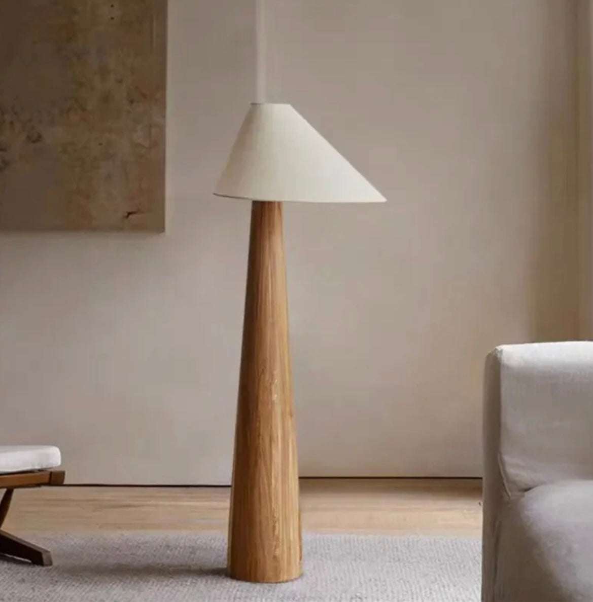Minimalist Wabi-sabi solid wood floor lamp with conical white shade in a modern living room setting