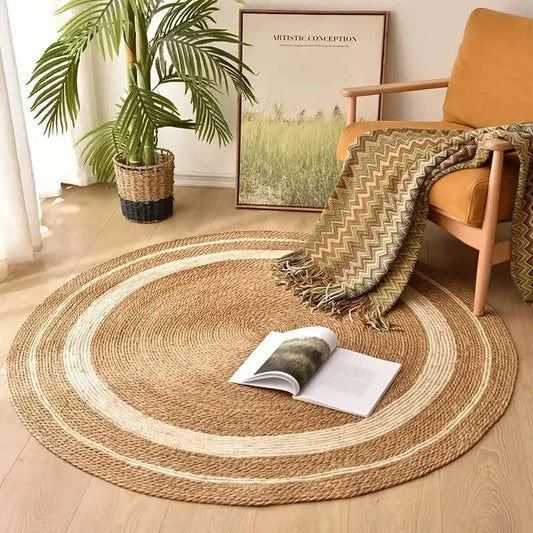 Round Nordic style woven rattan carpet with natural papyrus color stripes in cozy living room setting