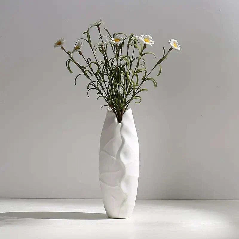 White hemp rope ceramic vase with minimalist design holding delicate white flowers