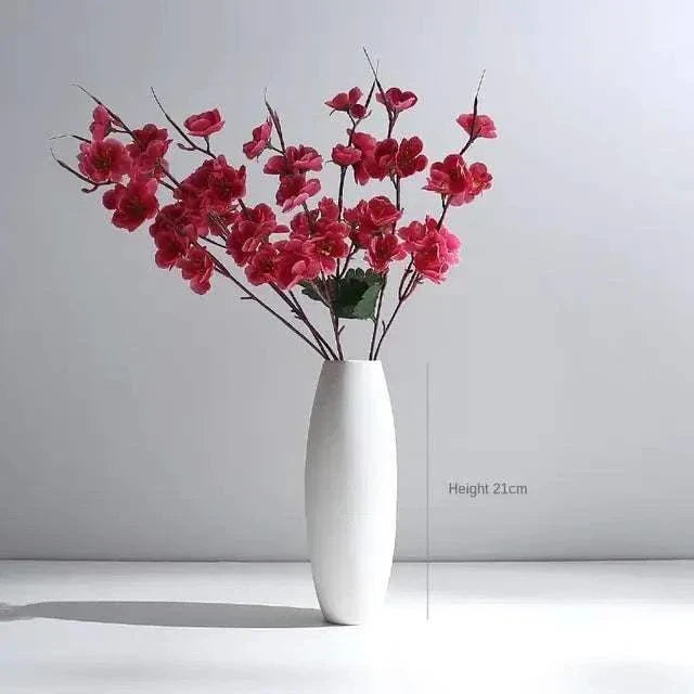 White Hemp Rope Ceramic Vase with minimalist design and red blossoms arrangement