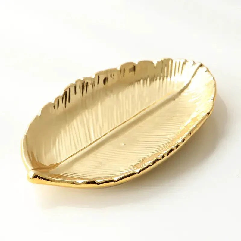 Gold leaf-shaped ceramic jewelry tray with electroplated finish for elegant storage and décor
