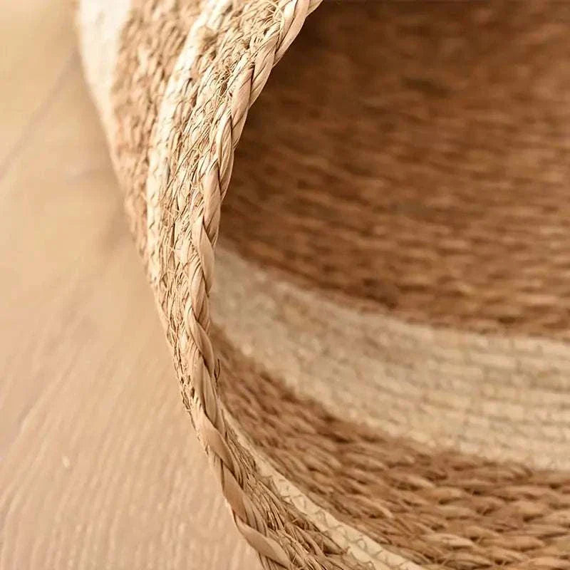 Close-up of natural rattan Nordic style woven carpet with papyrus color matching texture.