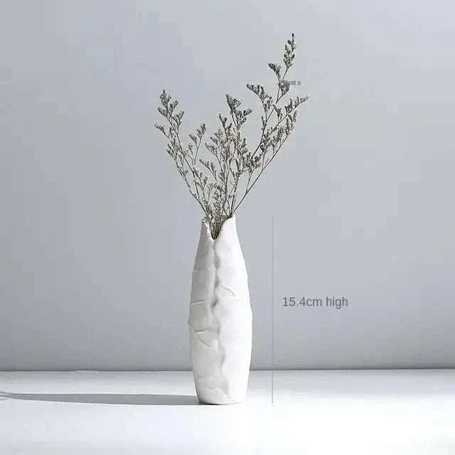 White Hemp Rope Ceramic Vase with minimalist white ceramic design and delicate hemp rope detail holding dried flower branches.