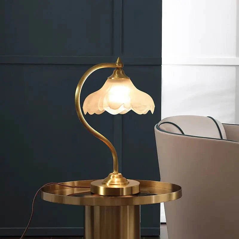 American-style copper decorative table lamp with curved design and frosted glass shade on round copper table
