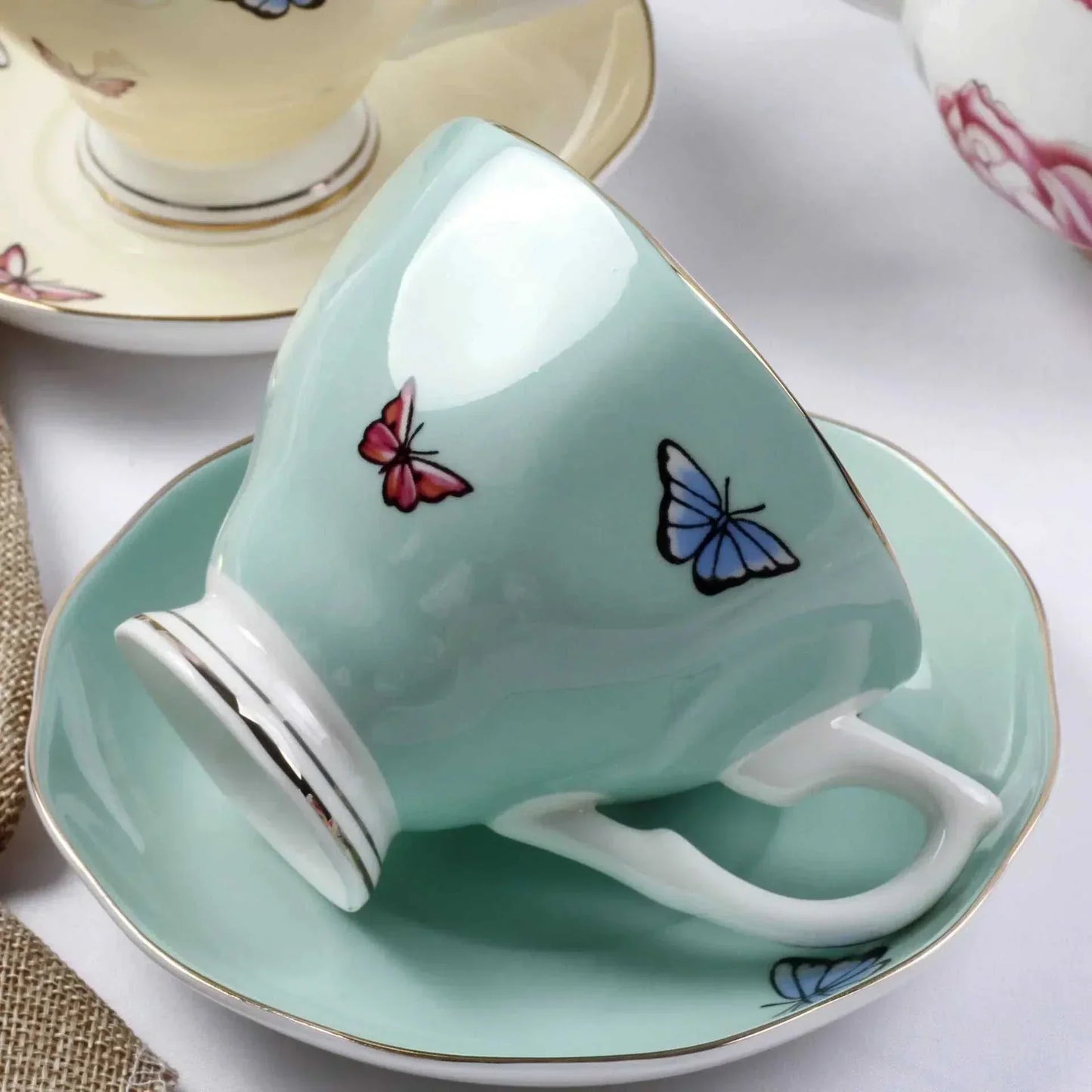 Bone China British Afternoon Tea Set cup and saucer in pastel green with butterfly design and gold rim