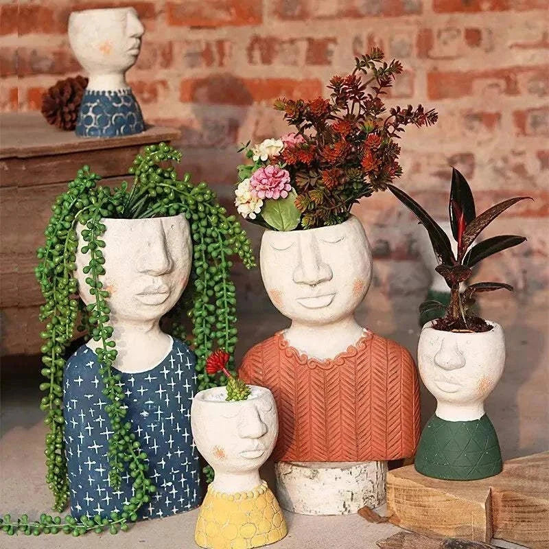 Artistic Portrait Sculpture cement planters with unique face designs and plants, decorative flower vases for indoor and outdoor spaces
